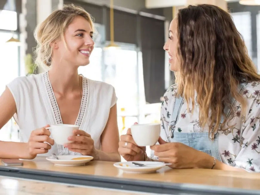 Two friends chatting over coffee — refer a future GBSS surrogate